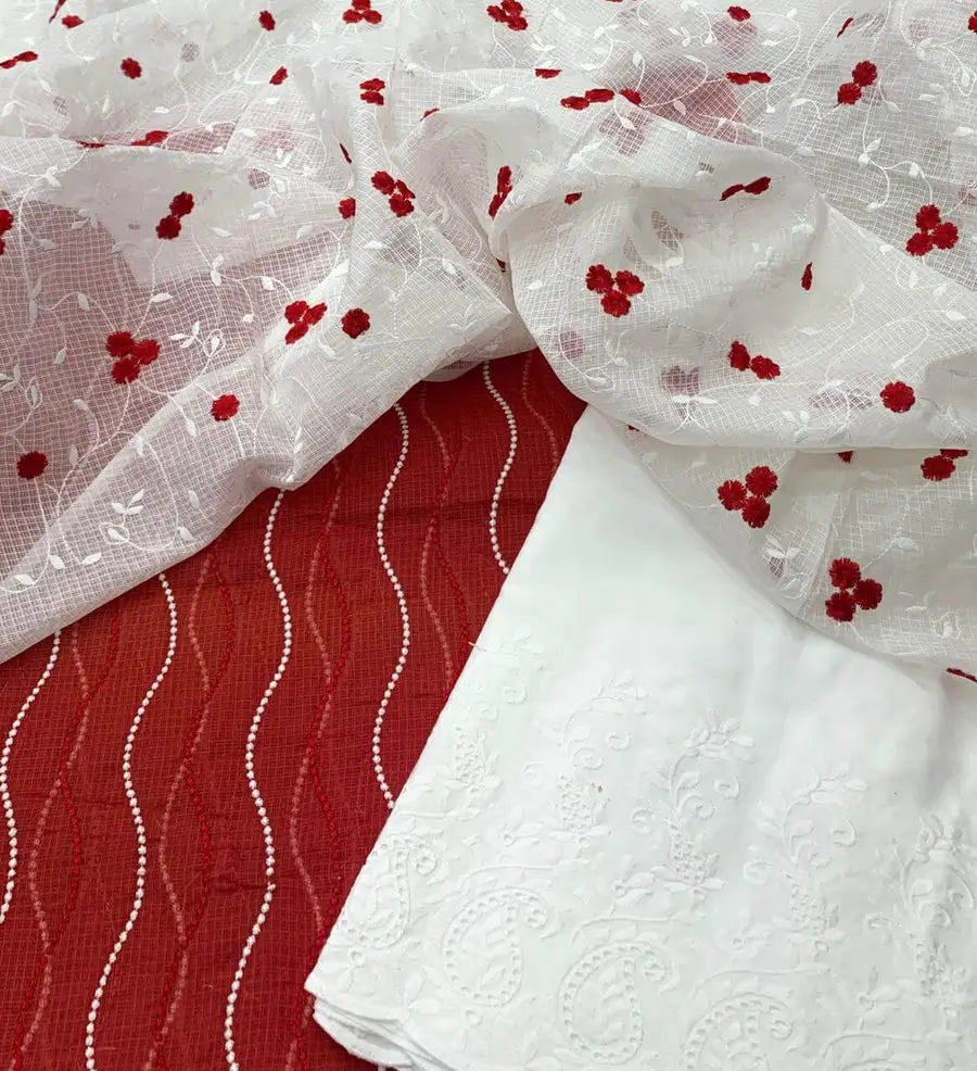 Red Kota Doria base with delicate white floral/vine embroidery and a white embroidered fabric.