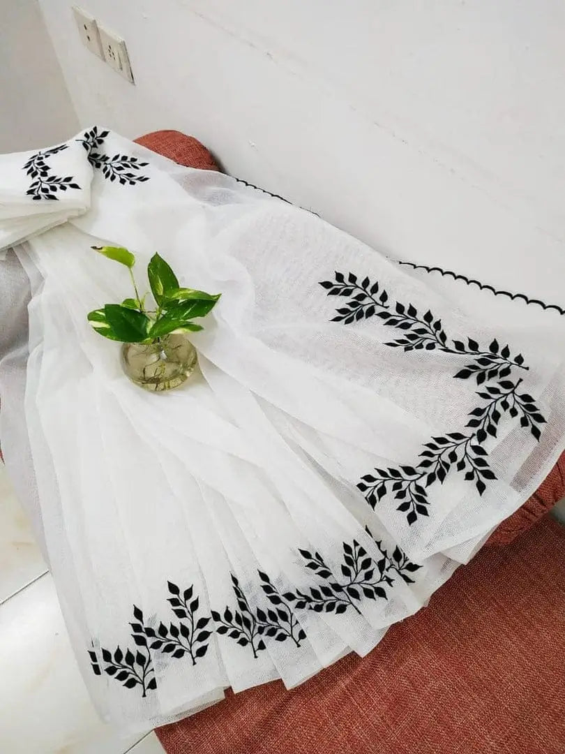 White Kota Doria cotton saree with black leaf embroidery and blouse